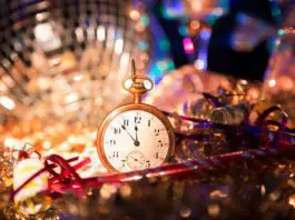 Small gold pocket watch surrounded by disco ball and tinsel at the las tiendas fun places in McAllen.