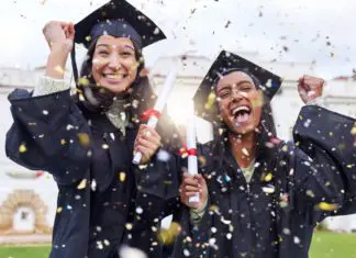 8 McAllen Restaurants to Celebrate the Graduate! Two young women in McAllen are smiling, dressed in black graduation gowns while confetti falls all over them.