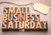 Wooden, rustic sign saying, "Small business Saturday," for downtown McAllen stores.