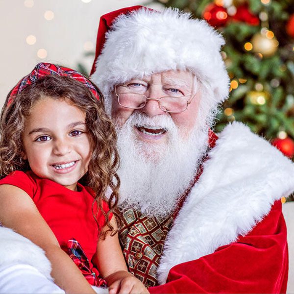 Close up of Santa with a brown-haired girl at the mcallen mall