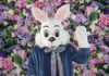 Large white Rabbit mascot sitting down at a McAllen Mall.