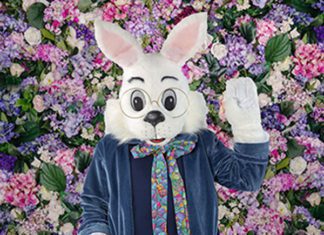 Large white Rabbit mascot sitting down at a McAllen Mall.