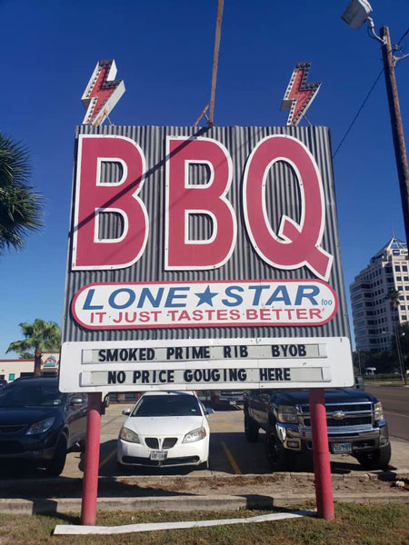 A sign in McAllen that reads ‘BBQ Lone Star - It Just Tastes Better’ in bold red and blue letters