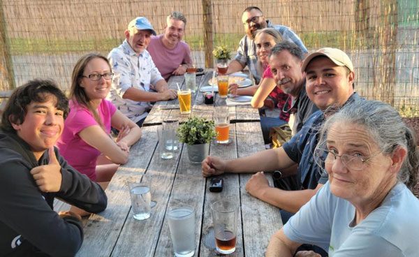 family enjoying drinks outdoors with fun things to do in McAllen TX.